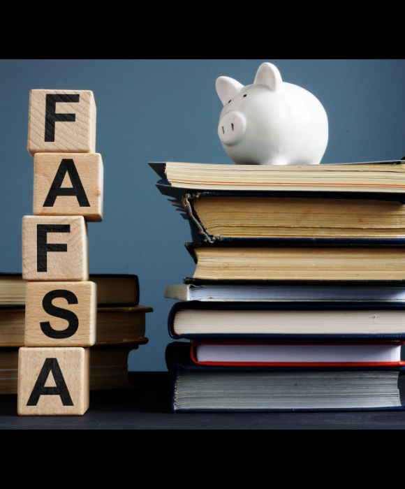 Image of piggy bank next to stacked blocks spelling "FAFSA"