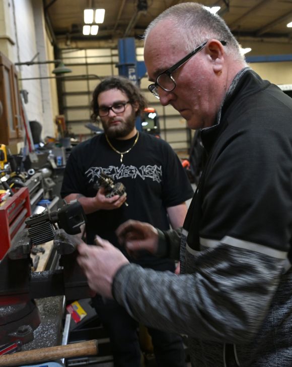 KCC adjunct professor George Mateja with a student