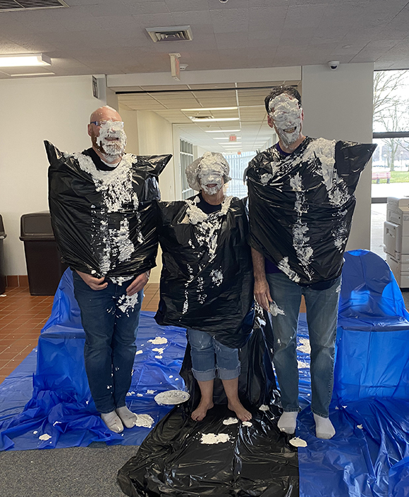 KCC staff members participate in a previous "pie-in-the-face" fundraiser