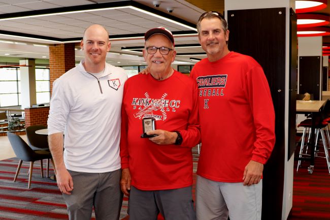Roy Cordes, "The Voice of the Cavaliers" (center) with KCC's athletics director Bryce Shafer (left) and retired athletics director Todd Post (right)